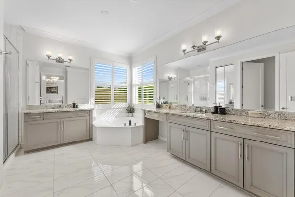 a bathroom with a sink vanity mirror and toilet