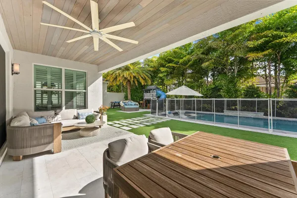 a view of a house with pool porch and sitting area