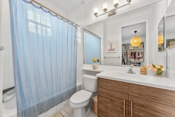 a bathroom with a toilet a sink and a shower