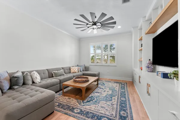 a bathroom with a sink a toilet and shower curtain