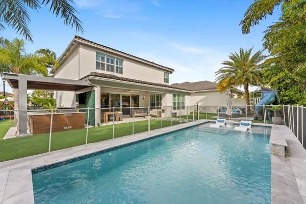 a view of a chairs and table in the patio
