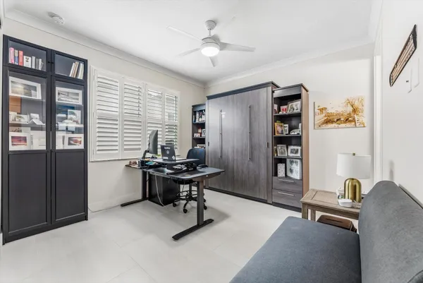an aerial view of a house with a swimming pool