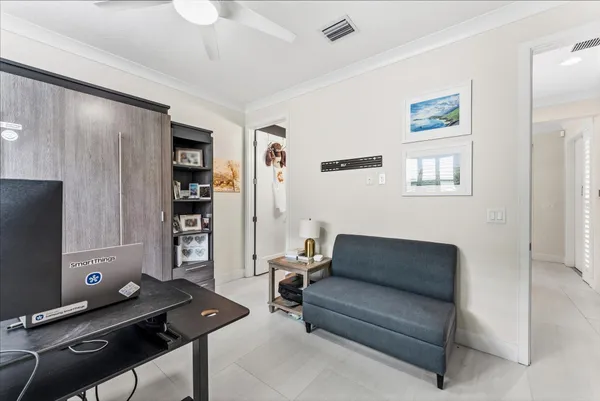 an aerial view of residential houses with outdoor space and swimming pool