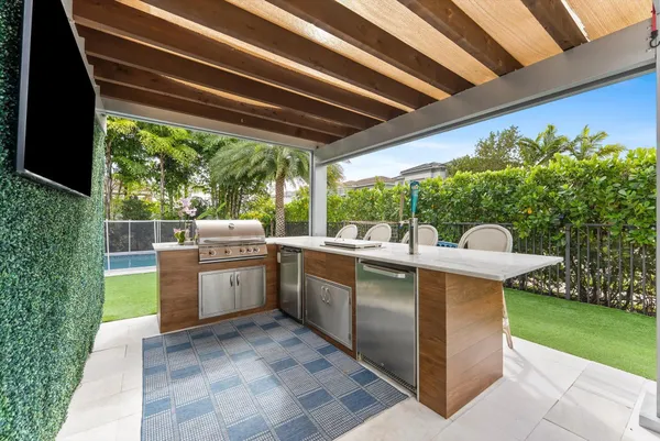 a view of a backyard with sitting area