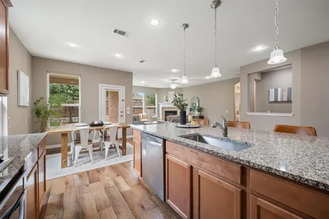 a large kitchen with lots of counter space and a sink