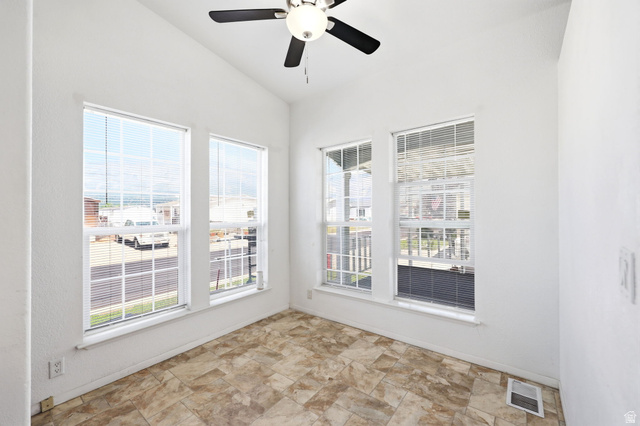 2491 Highway 89, Unit 614 Pleasant View, UT 84404 - Photo 12 of 27 Room with vaulted ceiling, ceiling fan, and five windows