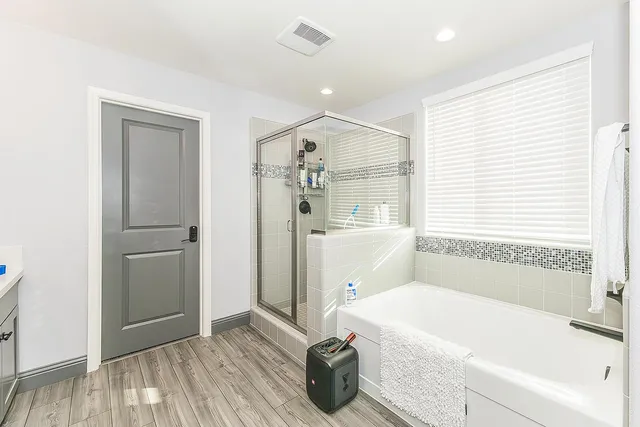 a bathroom with a double vanity sink mirror and