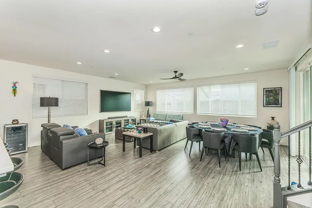 a living room with lots of furniture and a flat screen tv