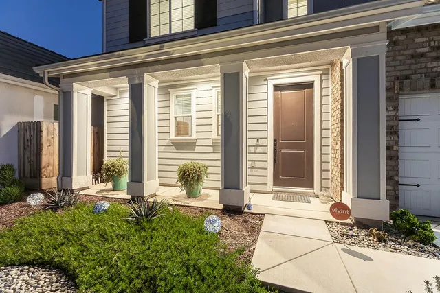 an aerial view of a residential apartment building with a yard
