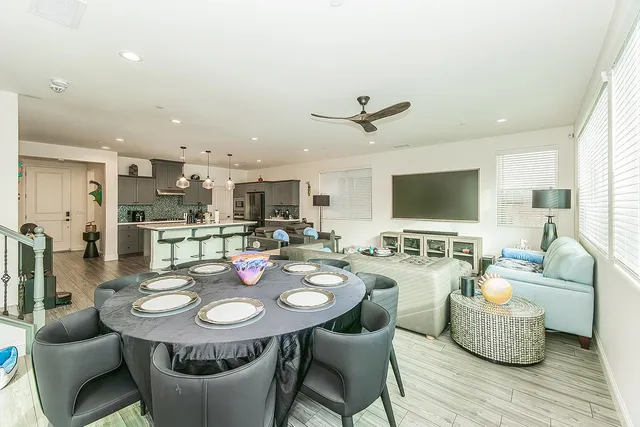 a view of a dining room with furniture and wooden floor