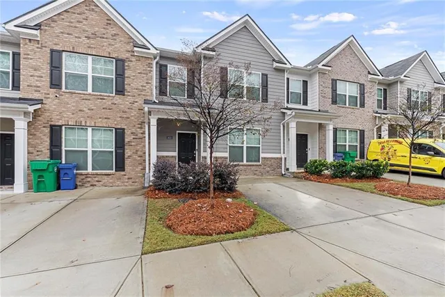front view of a house with a yard