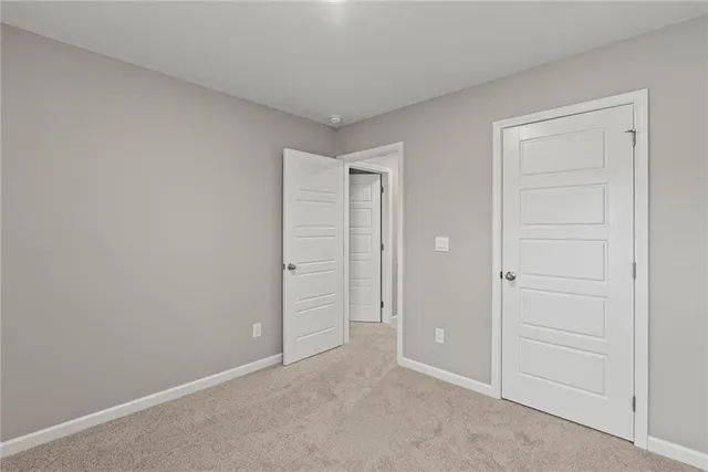 an empty room with closet area