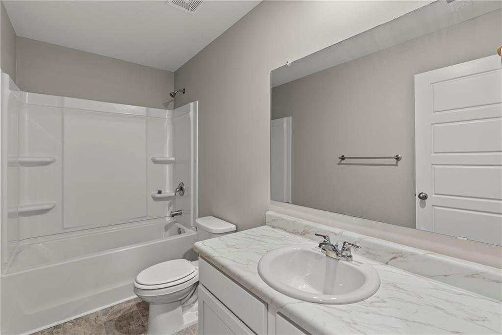 2650 Axel Ridge Decatur, GA 30034 - Photo 25 of 29 a bathroom with a sink toilet and shower