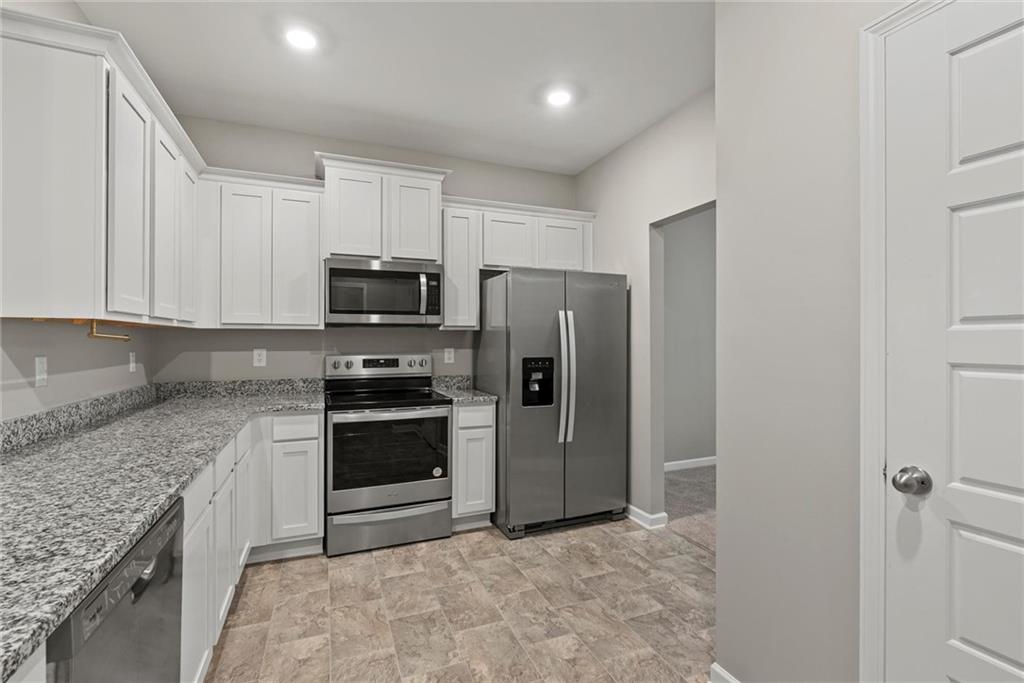 2650 Axel Ridge Decatur, GA 30034 - Photo 8 of 29 a kitchen with granite countertop a refrigerator and a sink