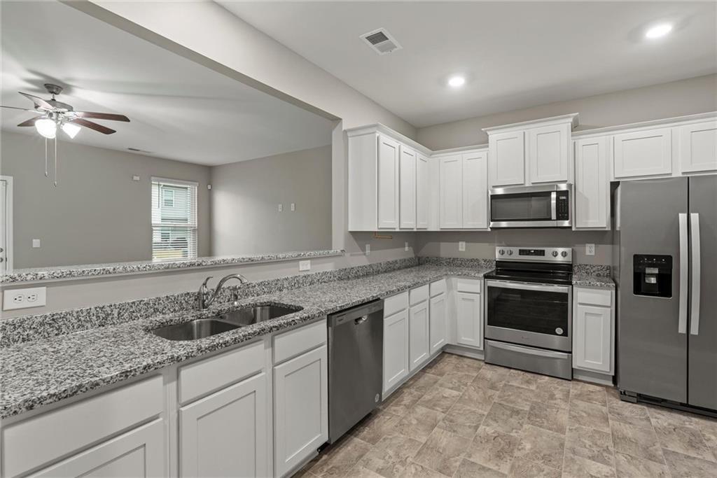 2650 Axel Ridge Decatur, GA 30034 - Photo 9 of 29 a kitchen with a sink stove and microwave