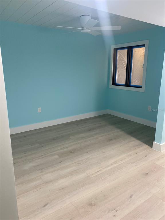 6035 Sea Ranch Drive, Unit 902 Hudson, FL 34667 - Photo 20 of 32 an empty room with a window