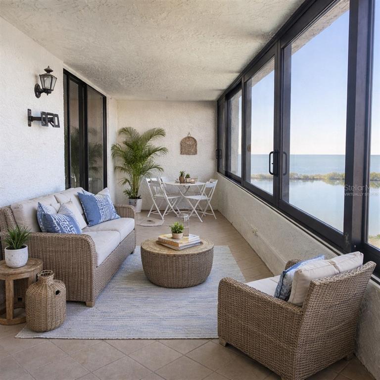 6035 Sea Ranch Drive, Unit 902 Hudson, FL 34667 - Photo 21 of 32 a living room with furniture and a large window