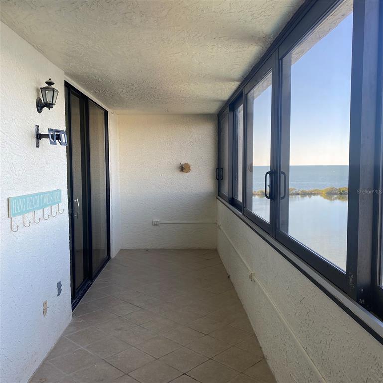 6035 Sea Ranch Drive, Unit 902 Hudson, FL 34667 - Photo 22 of 32 a view of a hallway with windows