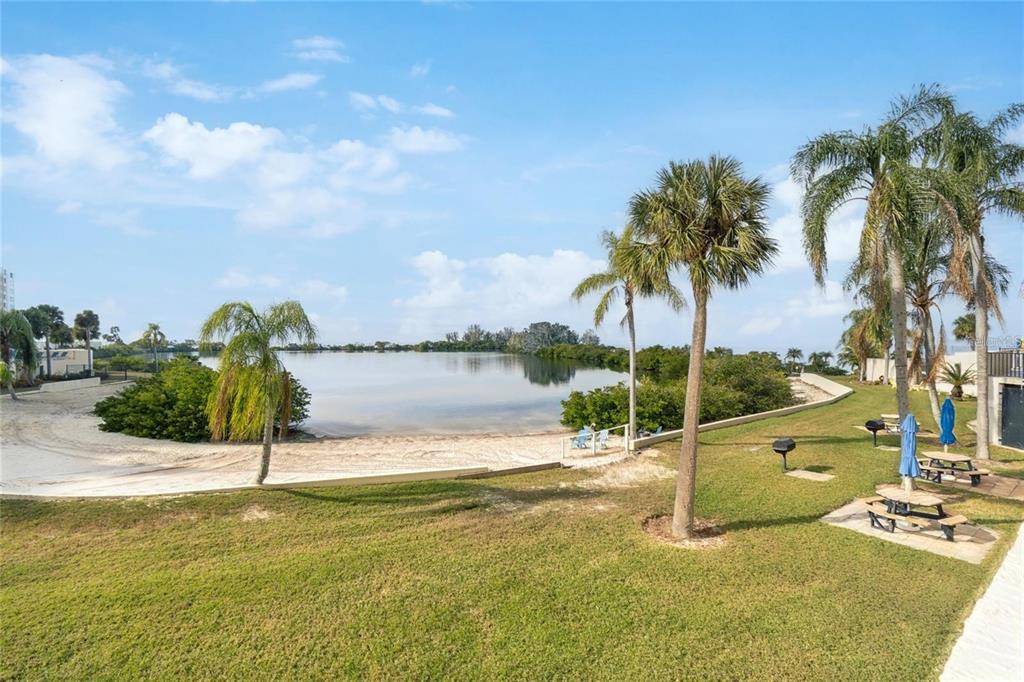 6035 Sea Ranch Drive, Unit 902 Hudson, FL 34667 - Photo 27 of 32 a view of lake view with palm trees