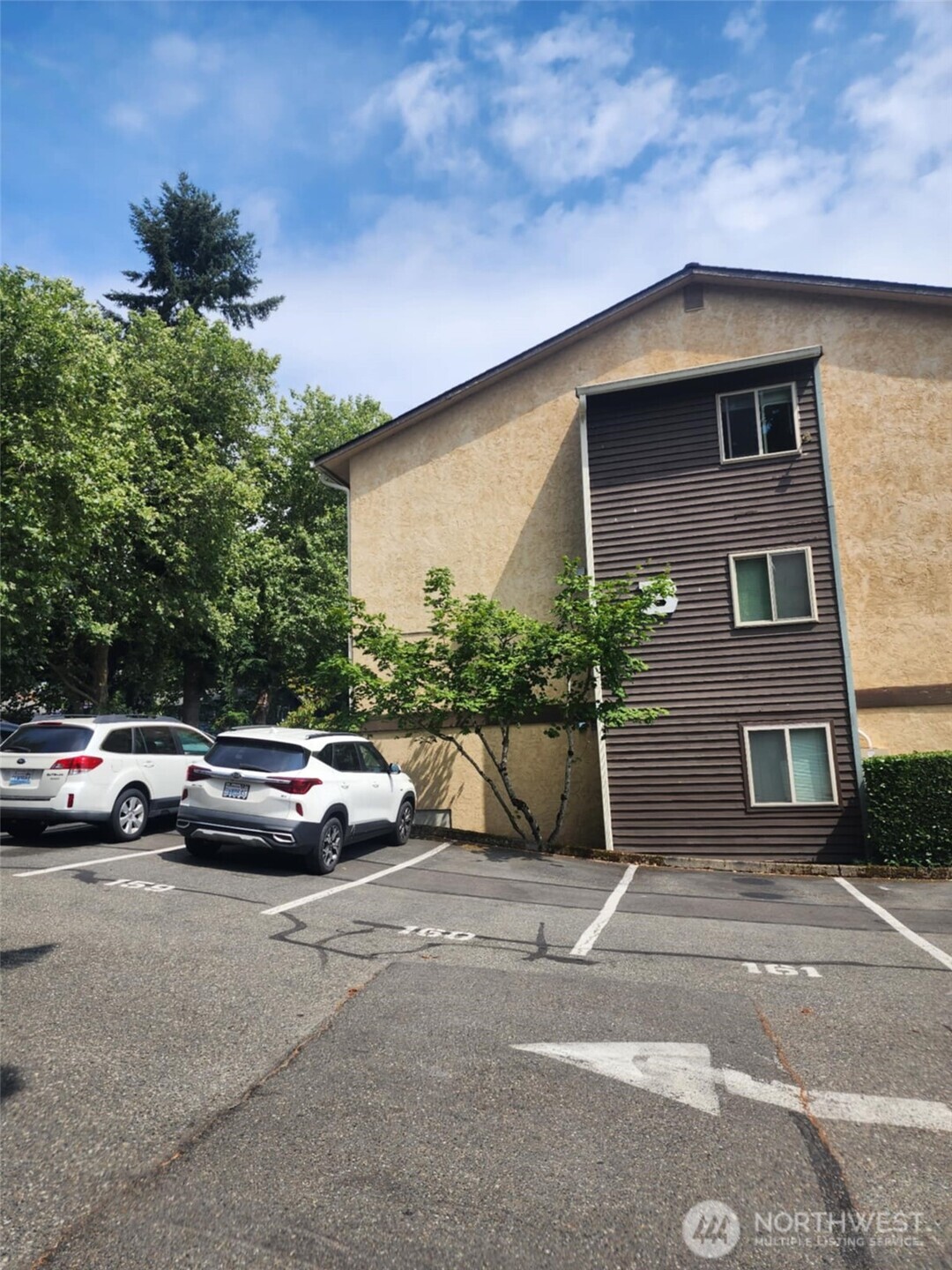 14510 124th Avenue Northeast, Unit B141 Kirkland, WA 98034 - Photo 1 of 17 a view of street with parked cars