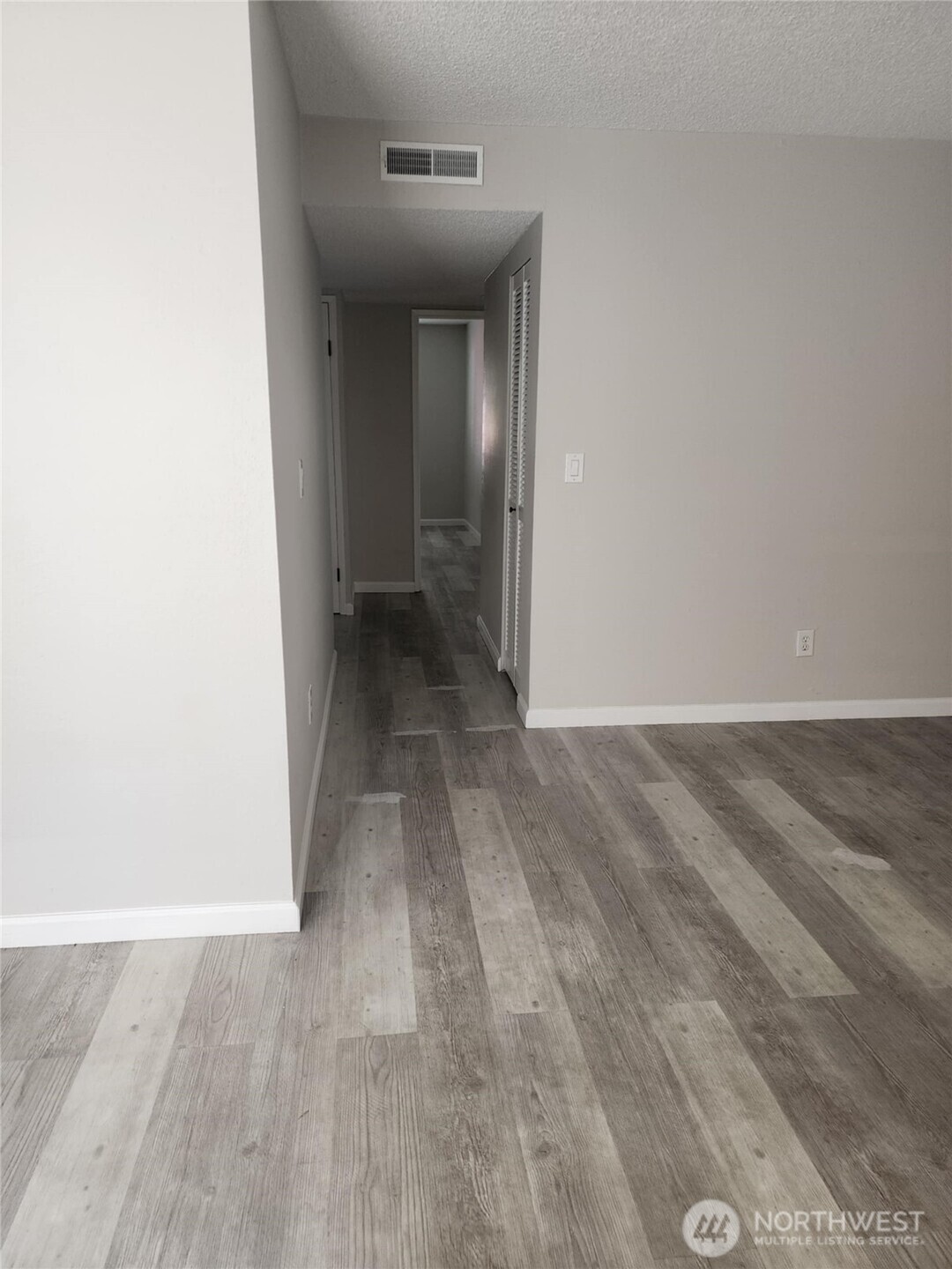 14510 124th Avenue Northeast, Unit B141 Kirkland, WA 98034 - Photo 16 of 17 a view of a room with wooden floor