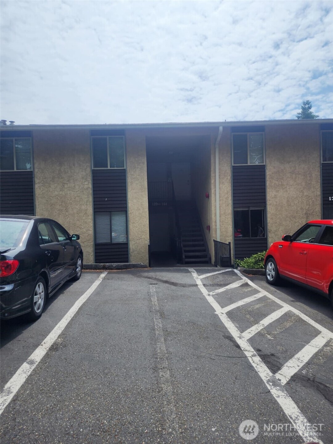 14510 124th Avenue Northeast, Unit B141 Kirkland, WA 98034 - Photo 2 of 17 a view of a car parked in front of a house