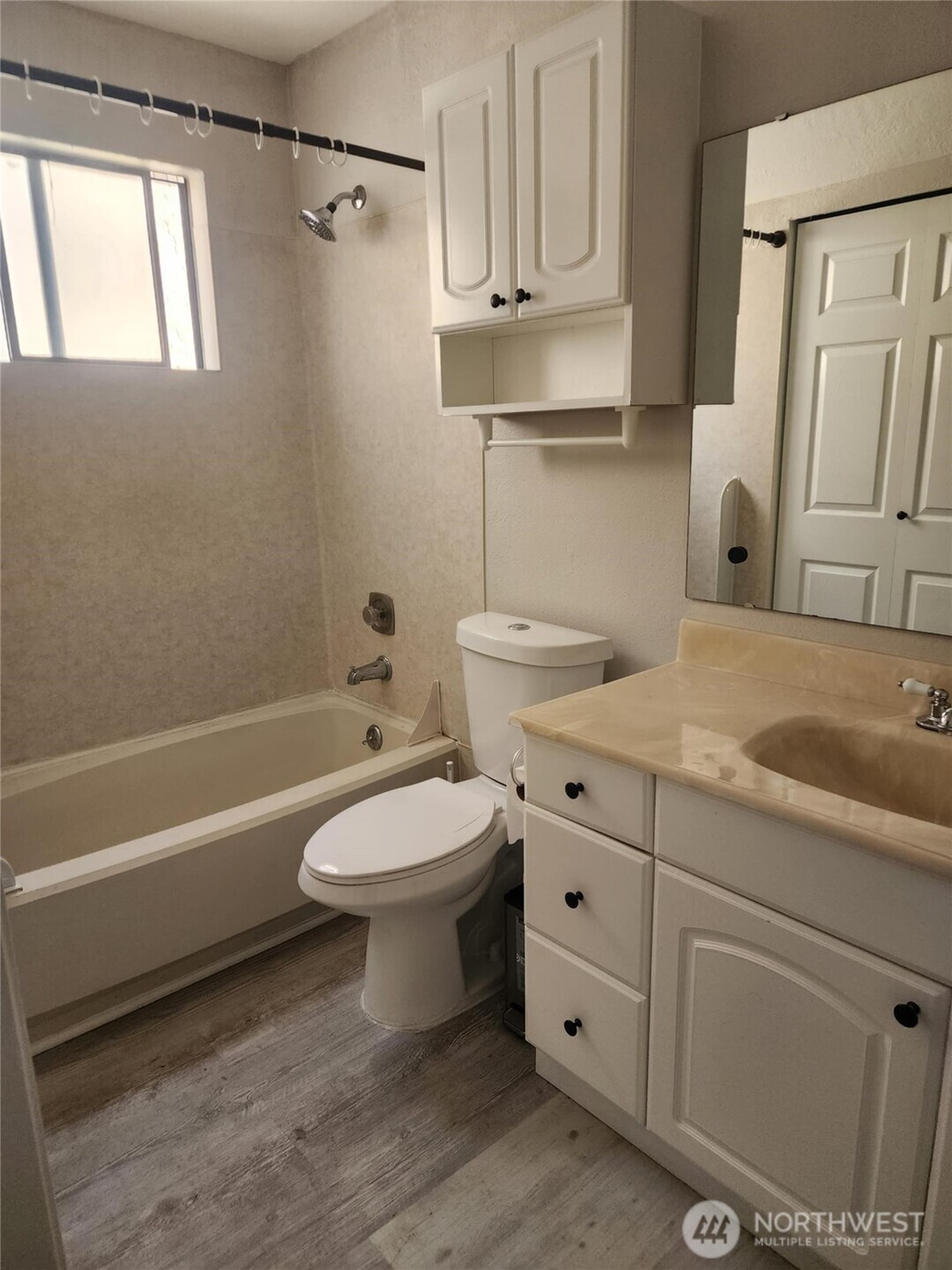 14510 124th Avenue Northeast, Unit B141 Kirkland, WA 98034 - Photo 8 of 17 a bathroom with a sink a toilet and bathtub