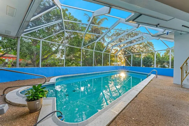 a view of a swimming pool with a patio