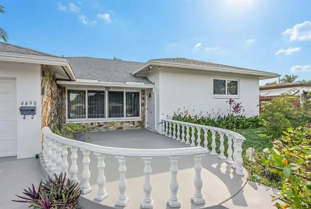 a backyard of a house with lots of green space