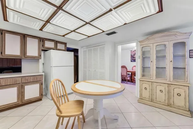 a kitchen with stainless steel appliances a refrigerator and a stove