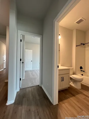a bathroom with a bathtub sink and toilet