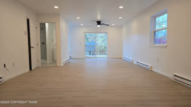 a view of an empty room with a window