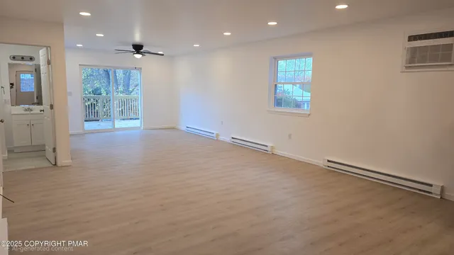 a view of an empty room with a window