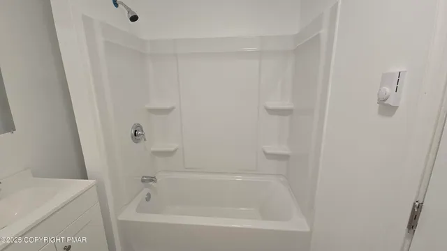 a close view of a bathtub in bathroom