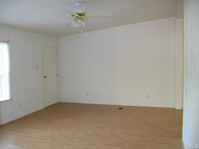 512 Fox Ridge Road Louisburg, NC 27549 - Photo 5 of 11 New Laminate flooring in the formal living room.
