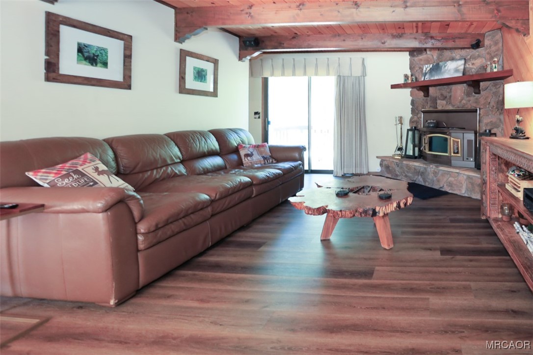 1201 Fox Farm Road Big Bear City, CA 92315 - Photo 14 of 16 a living room with furniture and a fireplace