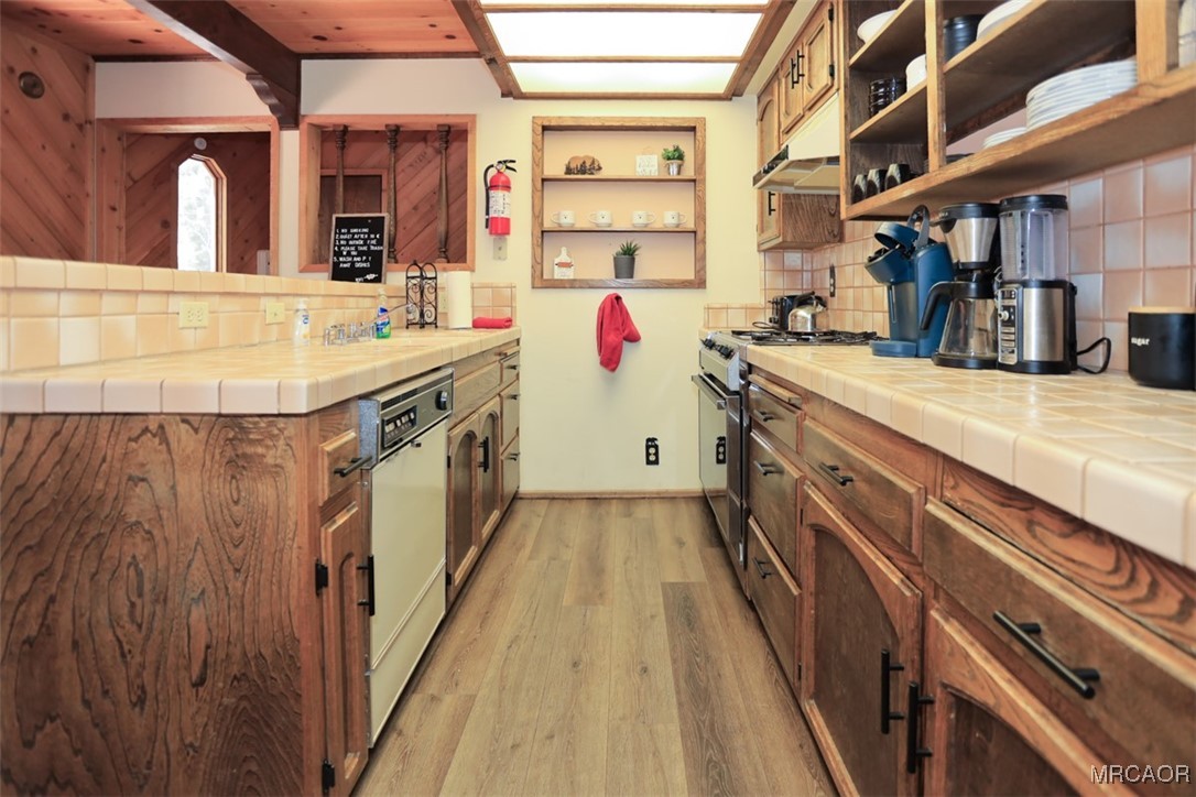 1201 Fox Farm Road Big Bear City, CA 92315 - Photo 4 of 16 a bathroom with a sink and a large mirror