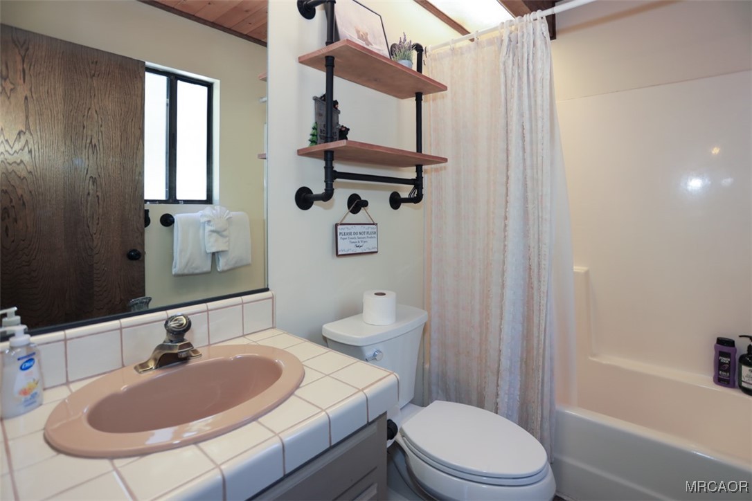 1201 Fox Farm Road Big Bear City, CA 92315 - Photo 6 of 16 a bathroom with a sink a toilet and shower
