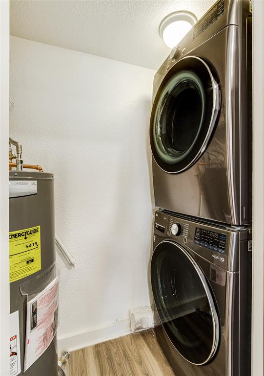 4777 Cedar Springs Road, Unit 7P Dallas, TX 75219 - Photo 14 of 28 a close up view of a washer and dryer in a utility room