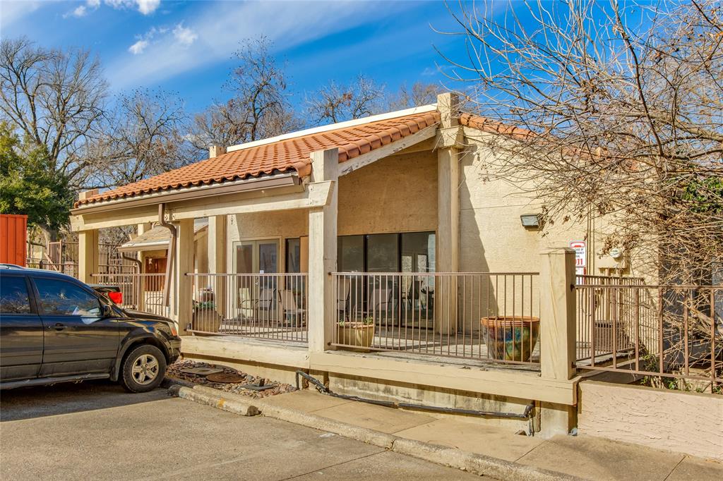 4777 Cedar Springs Road, Unit 7P Dallas, TX 75219 - Photo 24 of 28 a car parked in front of a house