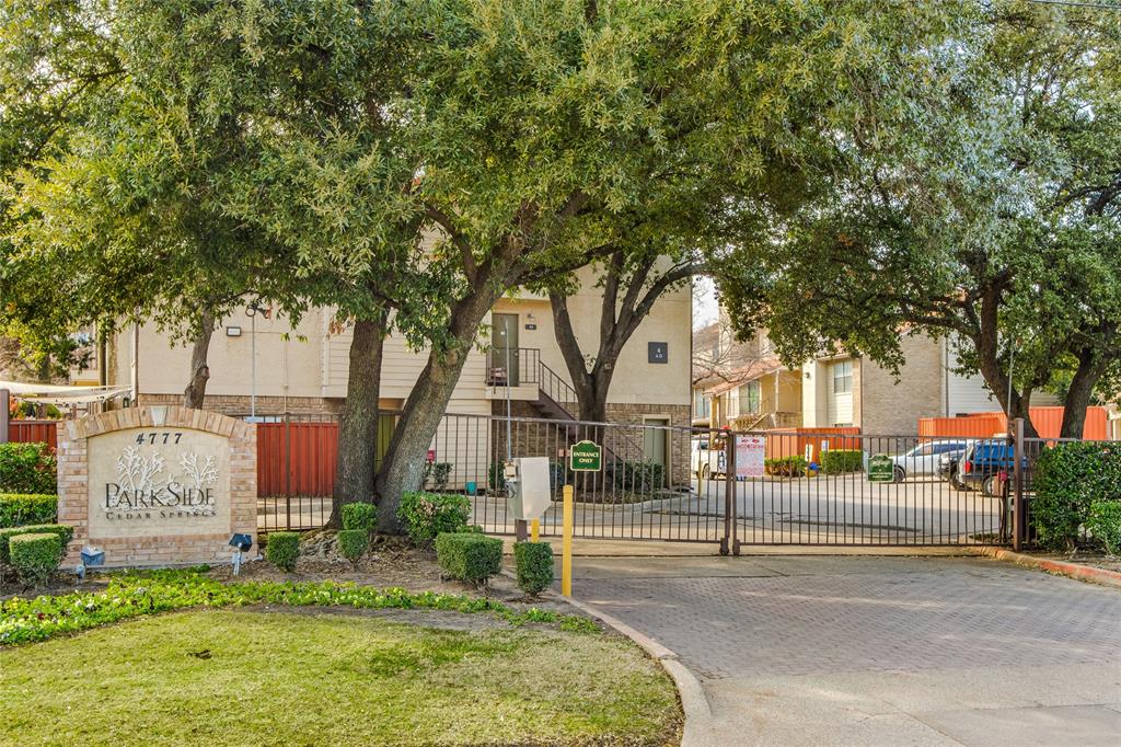 4777 Cedar Springs Road, Unit 7P Dallas, TX 75219 - Photo 25 of 28 a tree in front of a white house