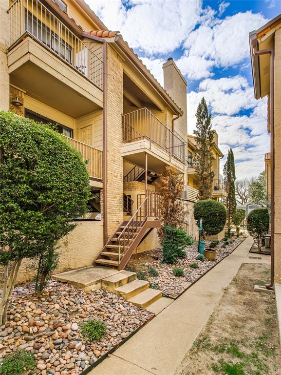 4777 Cedar Springs Road, Unit 7P Dallas, TX 75219 - Photo 27 of 28 a front view of a house with a yard