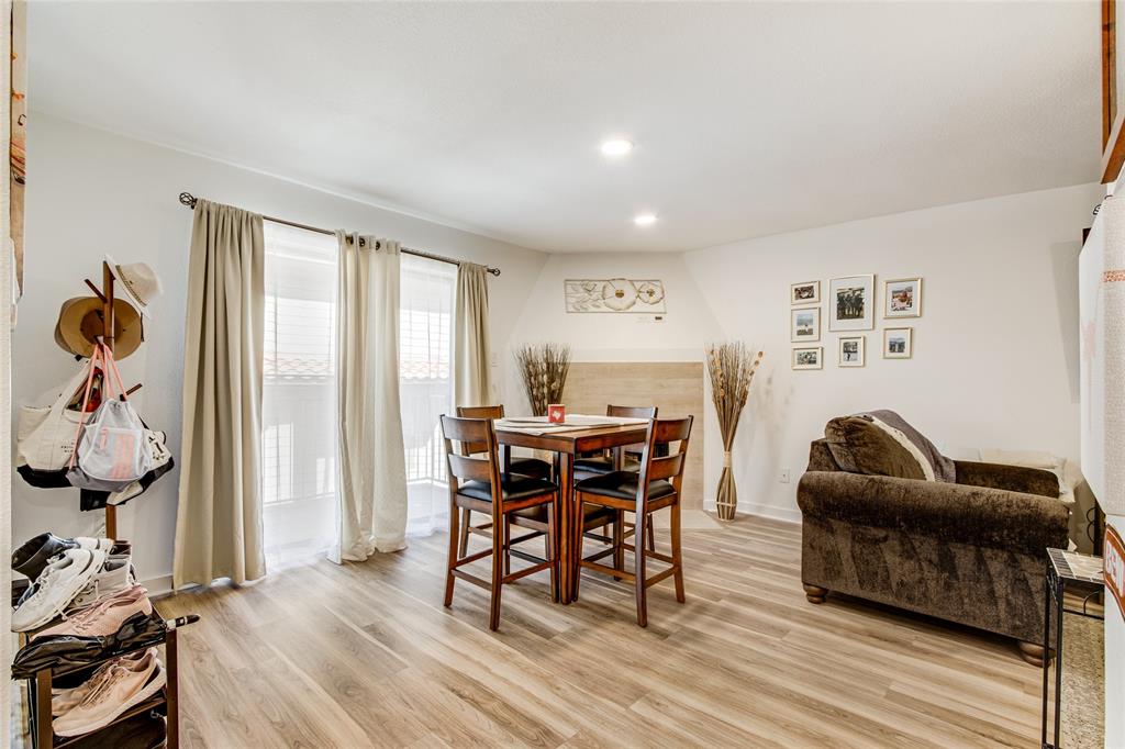4777 Cedar Springs Road, Unit 7P Dallas, TX 75219 - Photo 4 of 28 a dining room with furniture and wooden floor