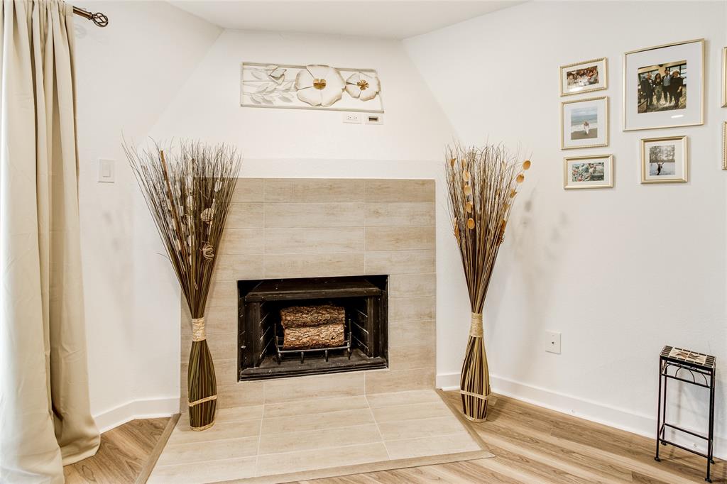 4777 Cedar Springs Road, Unit 7P Dallas, TX 75219 - Photo 6 of 28 a living room with a fireplace