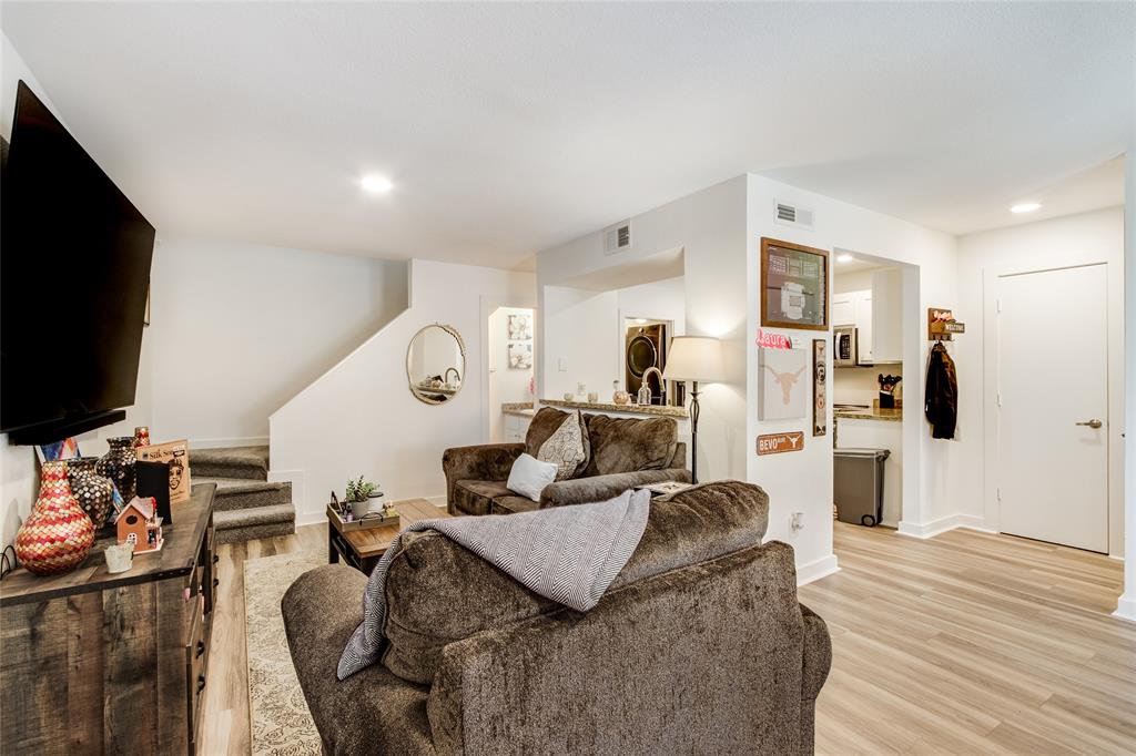 4777 Cedar Springs Road, Unit 7P Dallas, TX 75219 - Photo 8 of 28 a living room with furniture and a flat screen tv