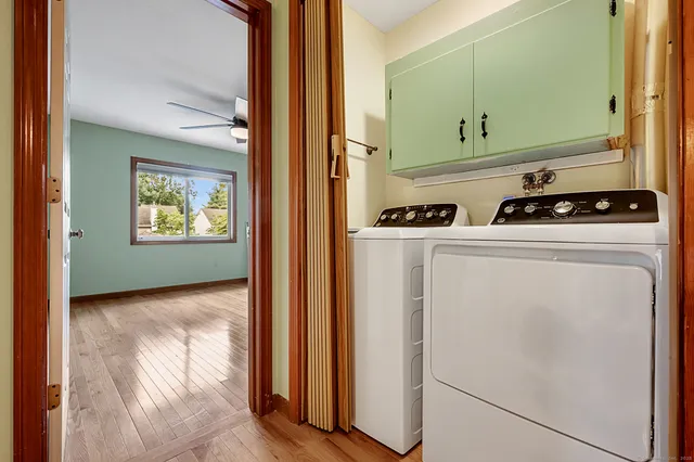a view of a storage and utility room with washer and dryer