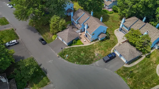 an aerial view of a house with outdoor space