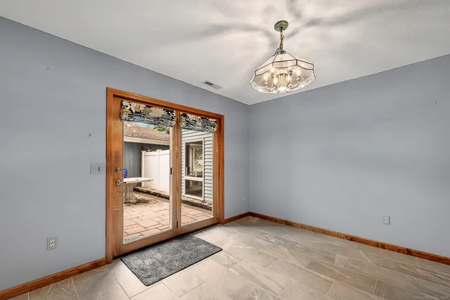 a view of an entryway with a chandelier