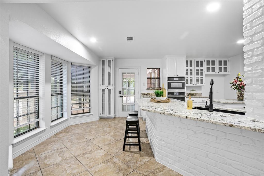 13510 Willow Springs Road Haslet, TX 76052 - Photo 11 of 39 a living room with granite countertop furniture and a wooden floor