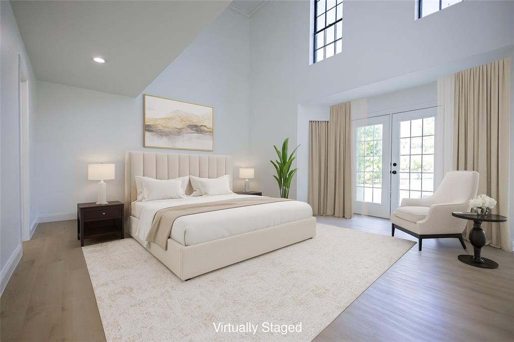 13510 Willow Springs Road Haslet, TX 76052 - Photo 14 of 34 a spacious bedroom with a bed and wooden floor
